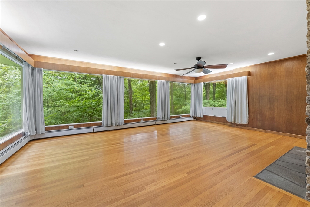 505 Mountain Road Wilbraham, MA 01095 - Photo 3 of 35 a view of an empty room with wooden floor and a window
