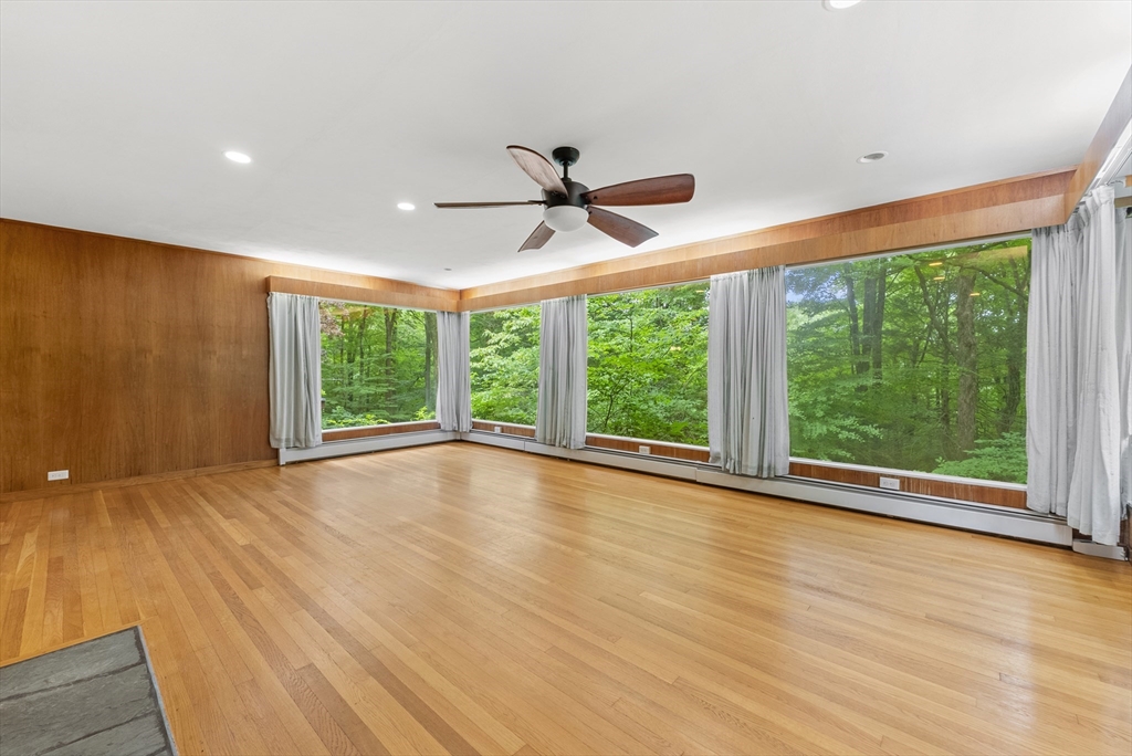 505 Mountain Road Wilbraham, MA 01095 - Photo 6 of 35 a view of an empty room with a window and wooden floor