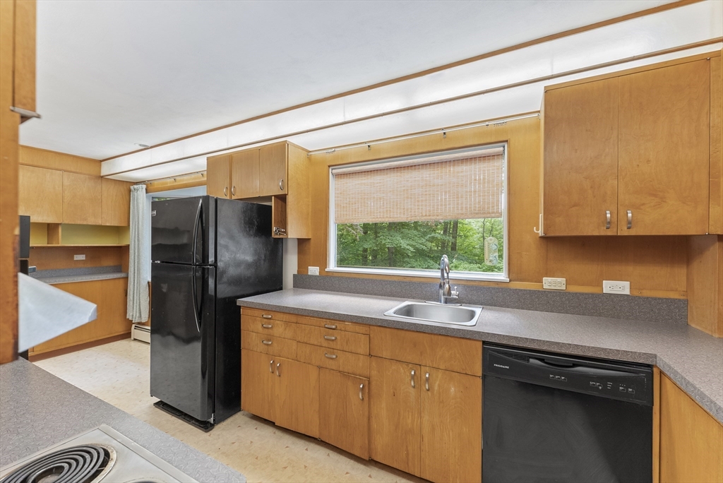 505 Mountain Road Wilbraham, MA 01095 - Photo 10 of 35 a kitchen with stainless steel appliances granite countertop a refrigerator and a sink