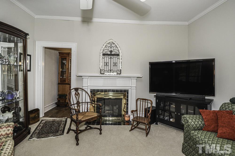3188 Macedonia Road Spring Hope, NC 27882 - Photo 45 of 84 a living room with furniture and a flat screen tv