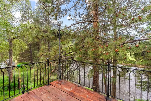 a balcony with trees in front of it