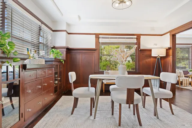 a front view of a house with lots of flowers