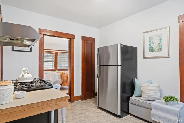 a front view of a house with a porch and livingroom view