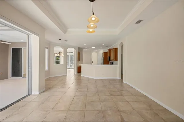 a kitchen with stainless steel appliances granite countertop a refrigerator a oven a sink a stove and a cabinets