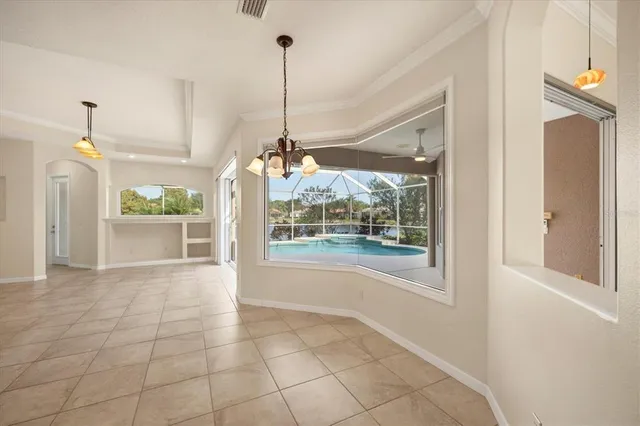 a view of a room wooden floor wooden floor and windows