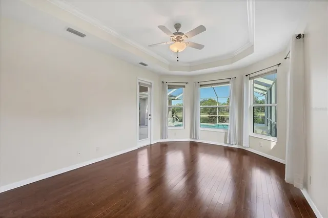 a spacious bathroom with a toilet a sink a mirror and a bathtub