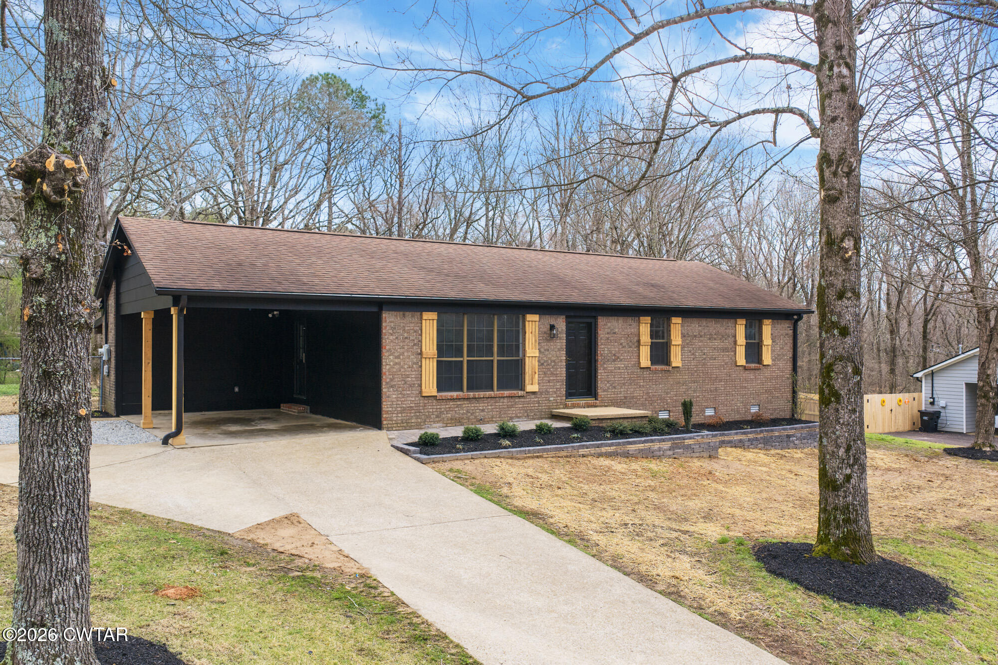 a front view of a house with yard
