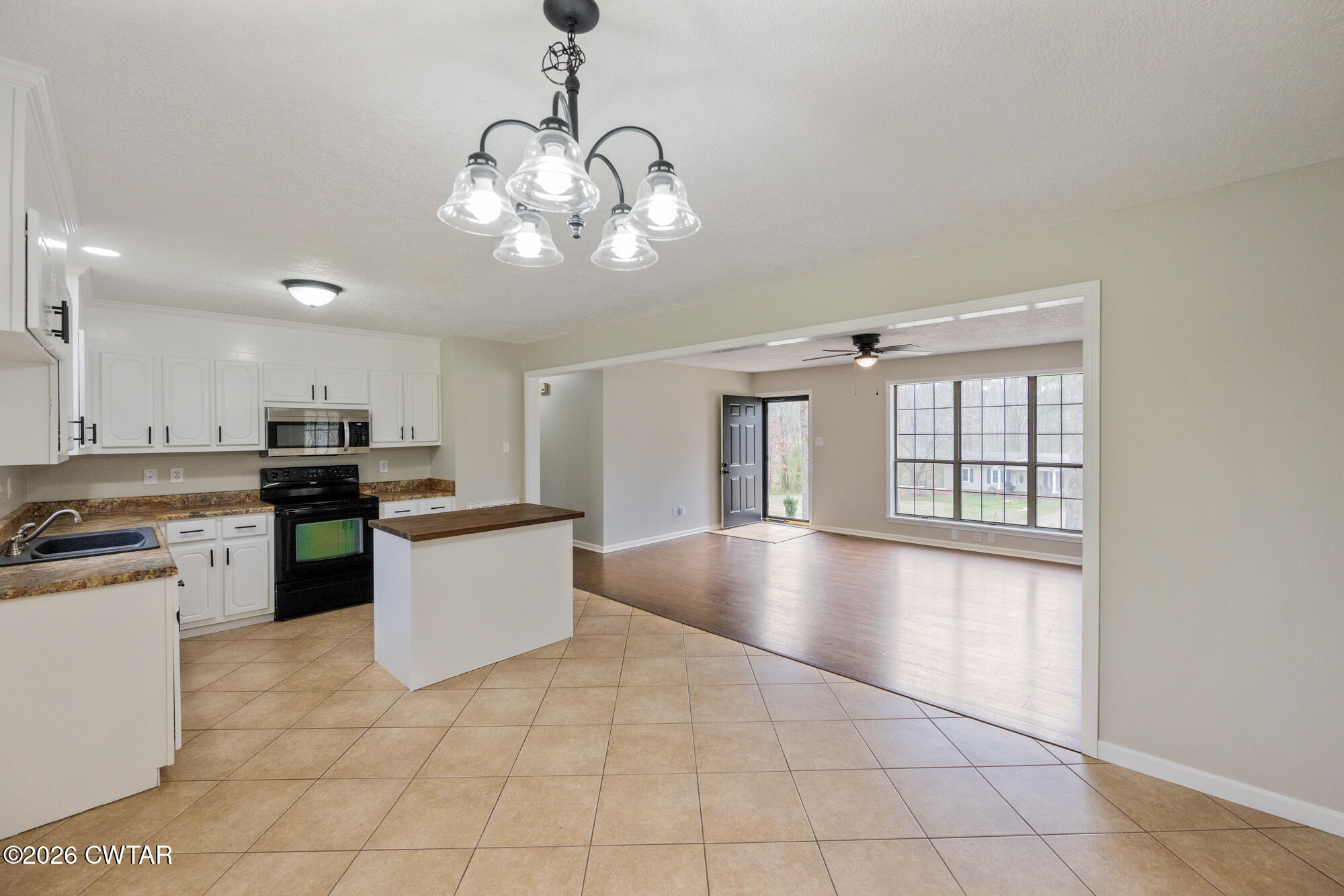 605 Parkburg Road Pinson, TN 38366 - Photo 10 of 15 a large kitchen with kitchen island a large counter space appliances and a view of kitchen