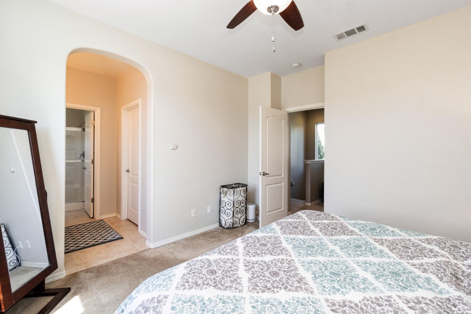 4103 Harlan Ranch Boulevard Clovis, CA 93619 - Photo 21 of 31 a bedroom with a bed and a dresser