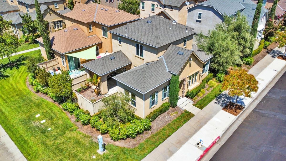4103 Harlan Ranch Boulevard Clovis, CA 93619 - Photo 27 of 31 an aerial view of a house with a garden and plants