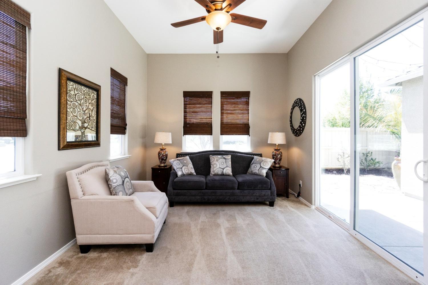 4103 Harlan Ranch Boulevard Clovis, CA 93619 - Photo 5 of 31 a living room with furniture and a large window