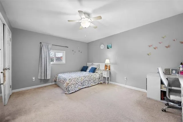 a bedroom with furniture and a chandelier