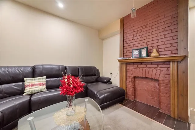 a living room with a couch and a fireplace