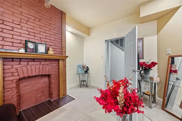 a living room with furniture and flowers