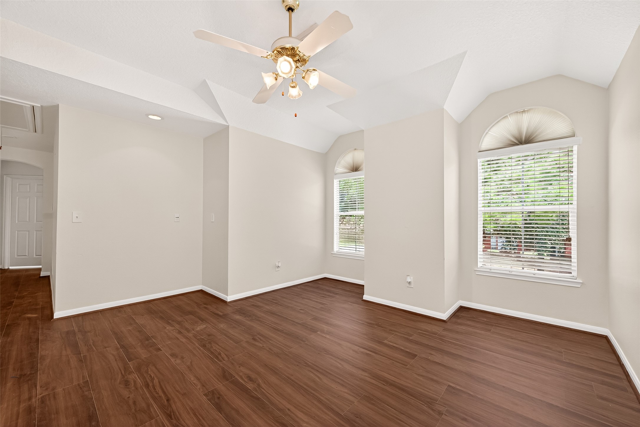 12831 Dove Point Lane Houston, TX 77041 - Photo 44 of 50 an empty room with wooden floor and windows