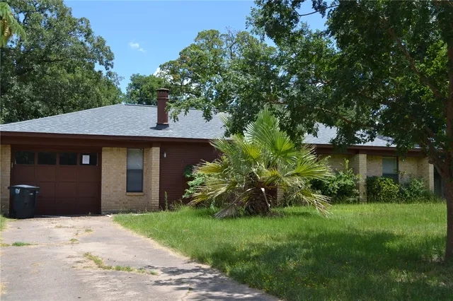 a house view with a garden space