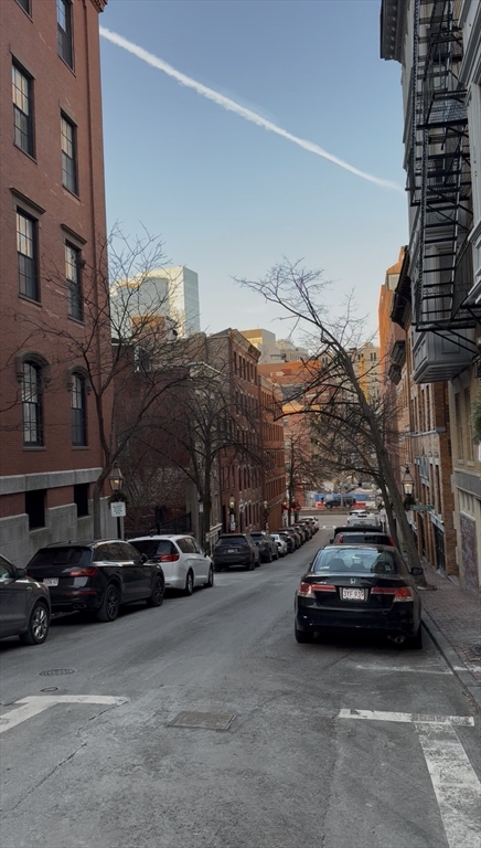 9 Anderson Street, Unit 1R Boston, MA 02114 - Photo 12 of 13 a car parked on the side of a street