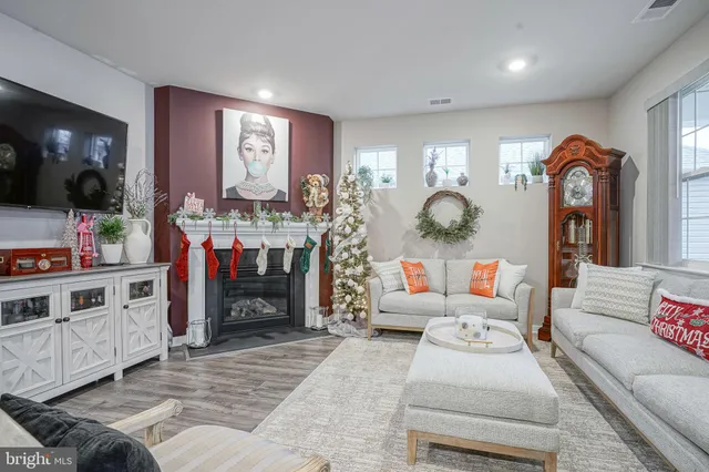 a kitchen with white cabinets and refrigerator