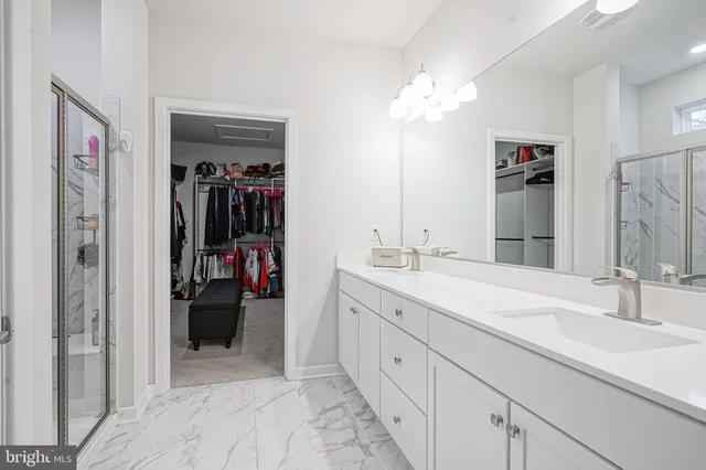 a view of a house with a yard and garage