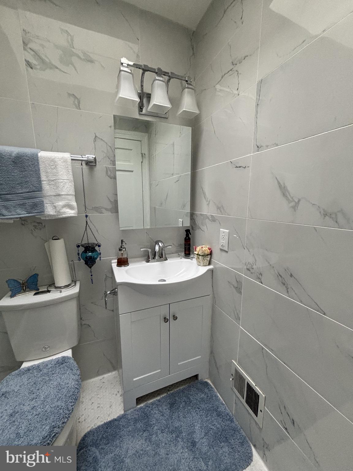 608 6th Place Southwest Washington, DC 20024 - Photo 53 of 65 Sleek modern bathroom with marble tiles.
