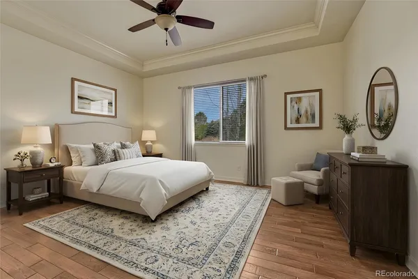 a bedroom with bed and wooden floor