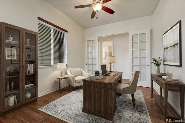 a living room with patio furniture and a window
