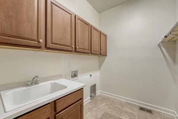 a bathroom with a sink and cabinets