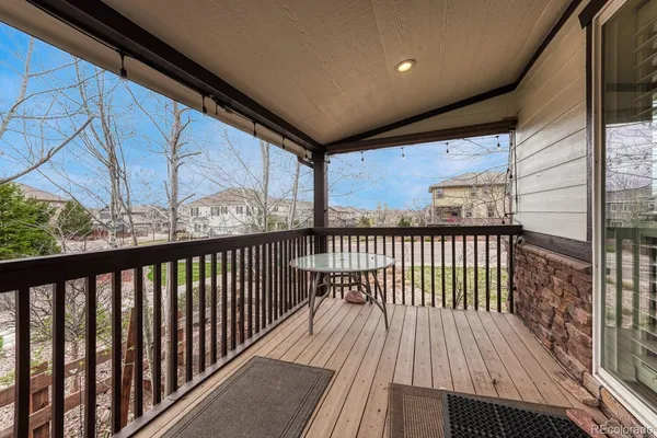 a view of balcony with wooden floor