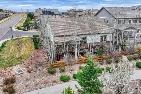 an aerial view of a house with a swimming pool outdoor seating