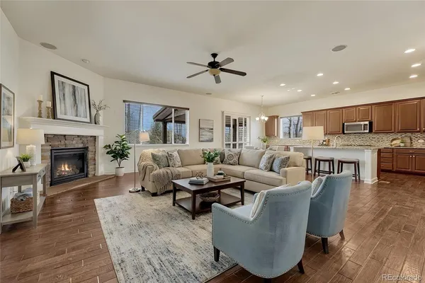 a living room with furniture and a fireplace