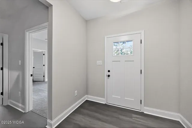 wooden floor with a chandelier