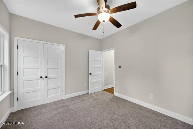 an empty room with a empty space and windows