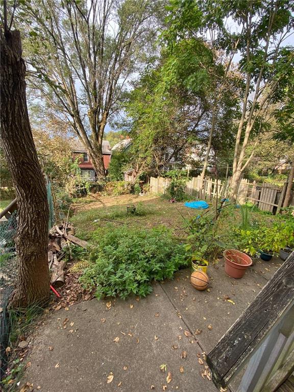 107 Overbrook Boulevard Pittsburgh, PA 15210 - Photo 4 of 21 a view of a backyard with chair and table