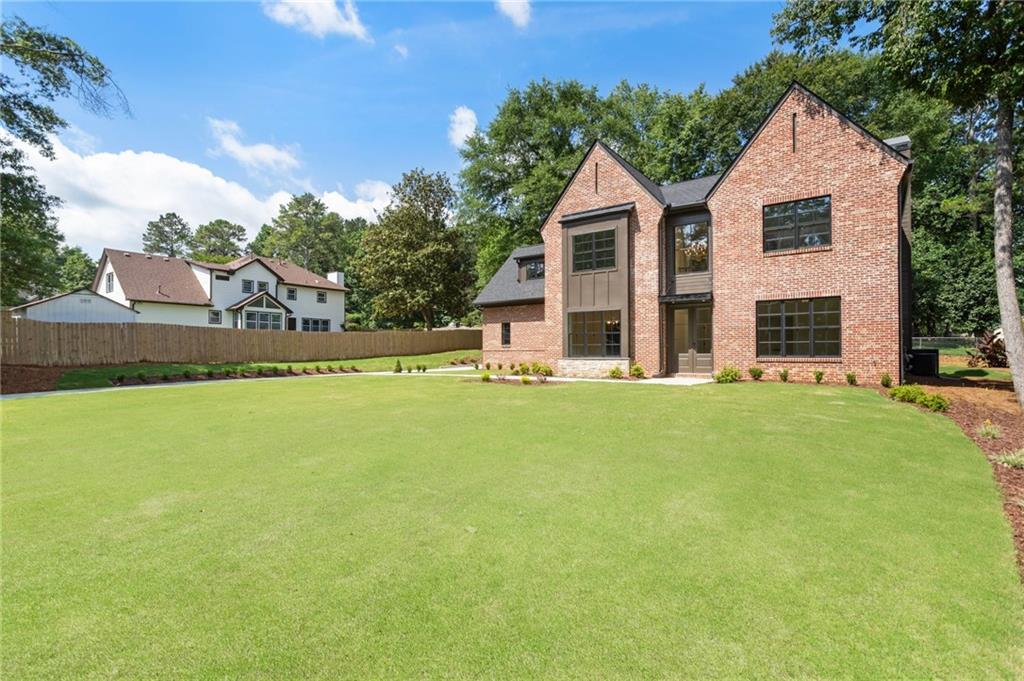 3711 Mountain Cove Road Snellville, GA 30039 - Photo 2 of 78 a view of a house with a swimming pool