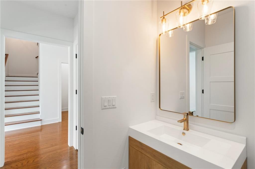 3711 Mountain Cove Road Snellville, GA 30039 - Photo 25 of 78 a bathroom with a sink and a mirror