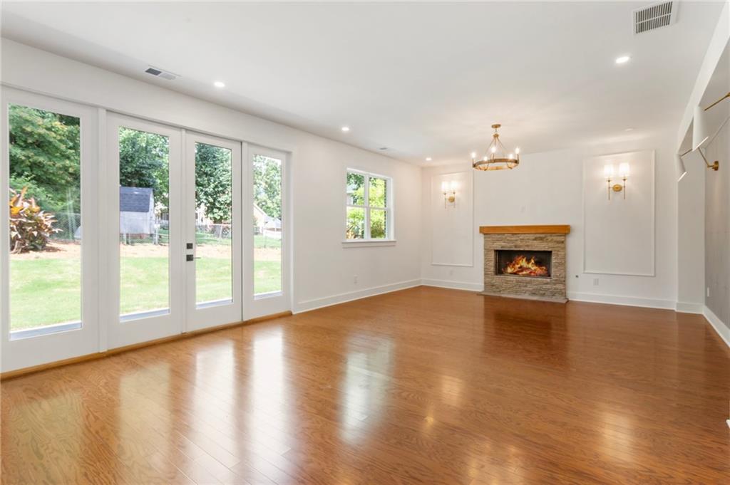 3711 Mountain Cove Road Snellville, GA 30039 - Photo 26 of 78 a view of an empty room with a window and wooden floor