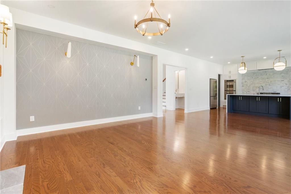 3711 Mountain Cove Road Snellville, GA 30039 - Photo 29 of 78 a view of a kitchen with a dishwasher cabinets and wooden floor
