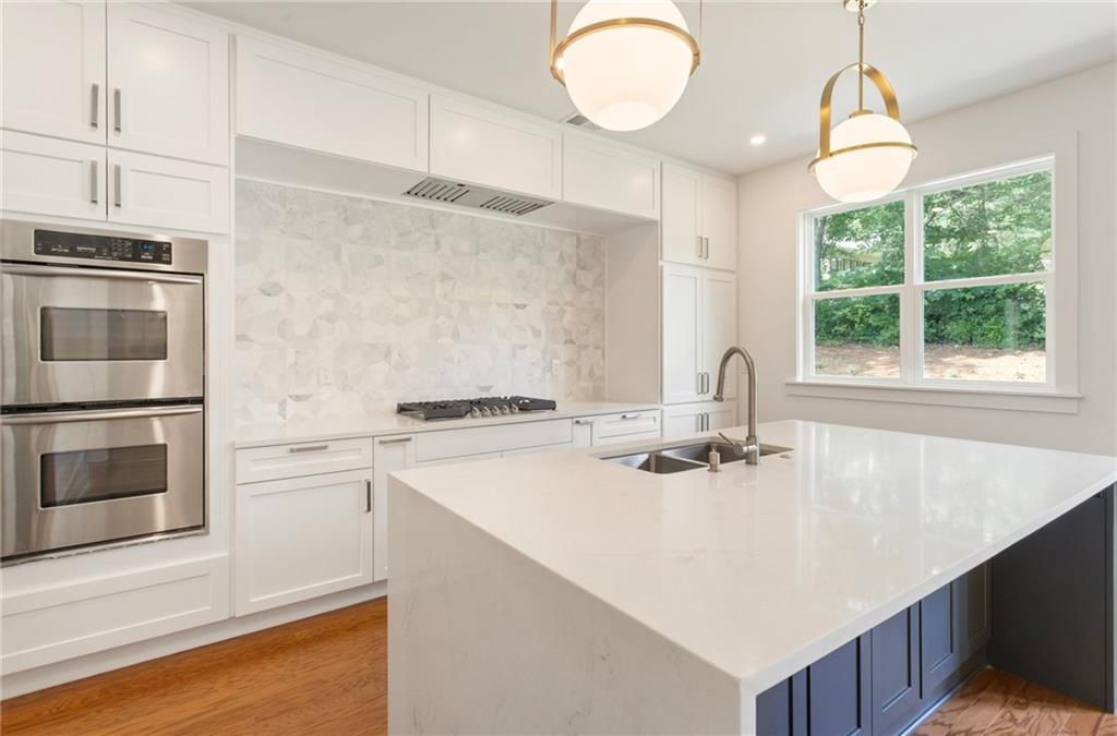3711 Mountain Cove Road Snellville, GA 30039 - Photo 36 of 78 a kitchen with a stove and a white refrigerator