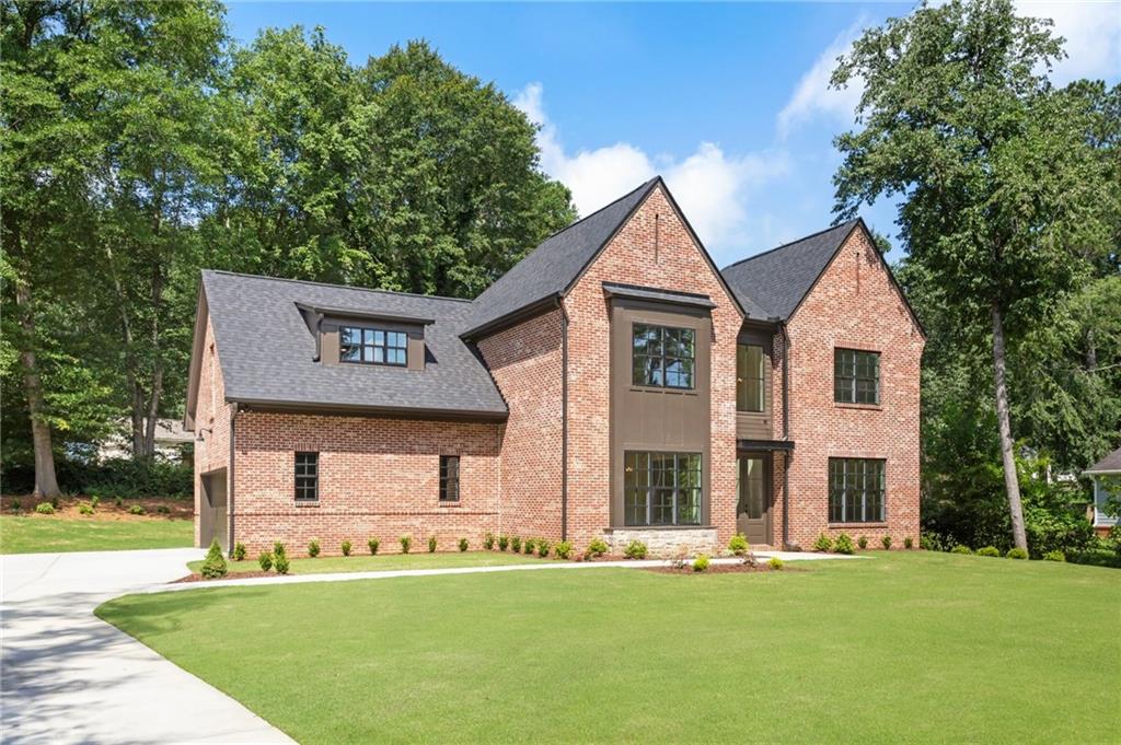 3711 Mountain Cove Road Snellville, GA 30039 - Photo 4 of 78 a front view of a house with a yard