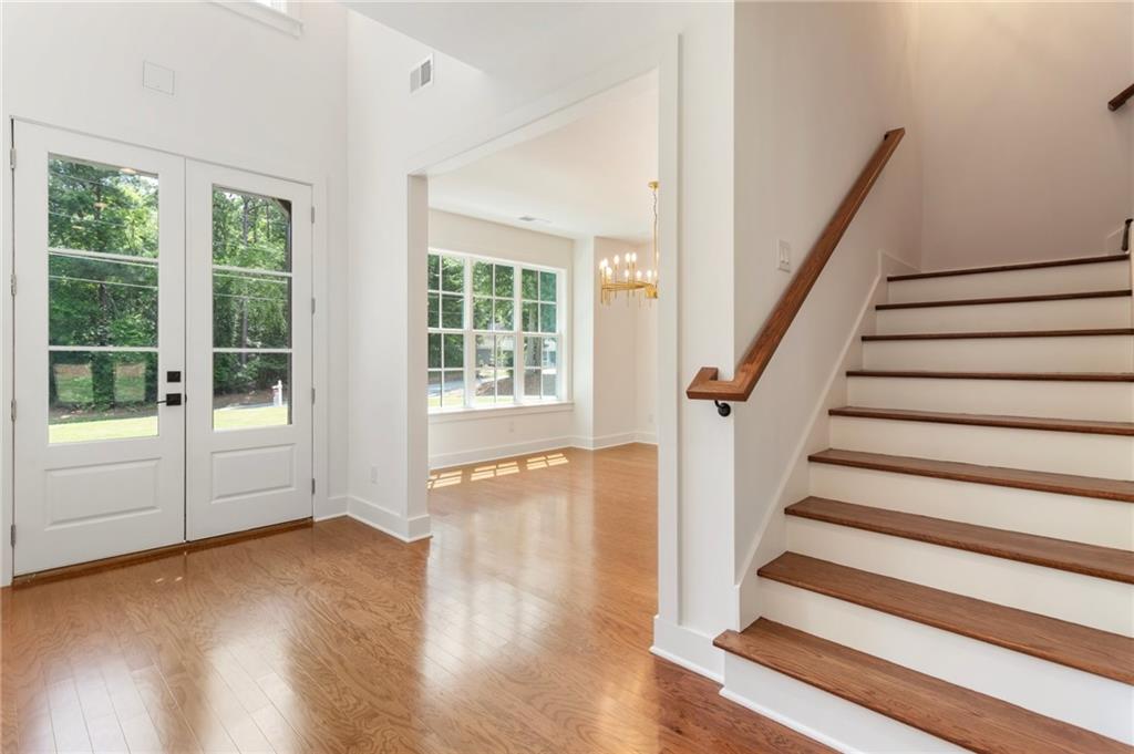 3711 Mountain Cove Road Snellville, GA 30039 - Photo 44 of 78 a view of entryway with wooden floor and front door