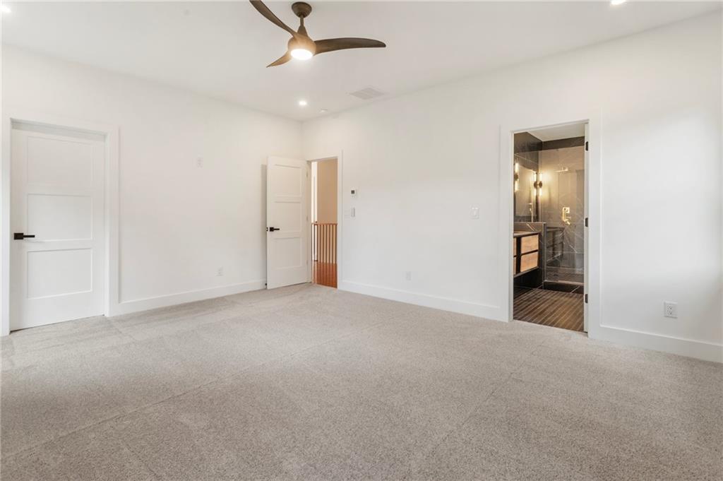 3711 Mountain Cove Road Snellville, GA 30039 - Photo 46 of 78 an empty room with ceiling fan and entryway