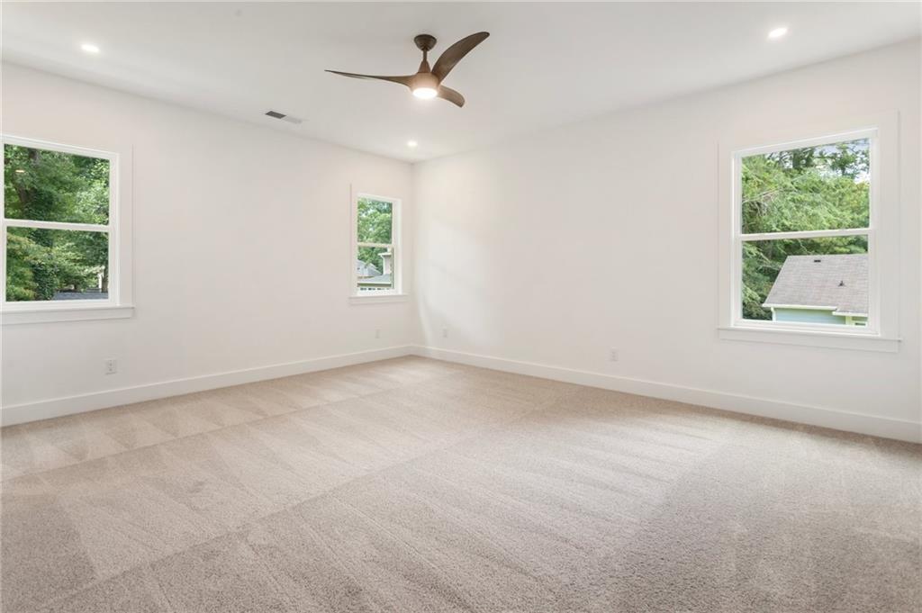 3711 Mountain Cove Road Snellville, GA 30039 - Photo 47 of 78 an empty room with windows and closet