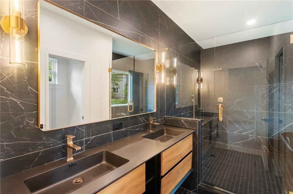 3711 Mountain Cove Road Snellville, GA 30039 - Photo 49 of 78 a bathroom with a sink and a mirror