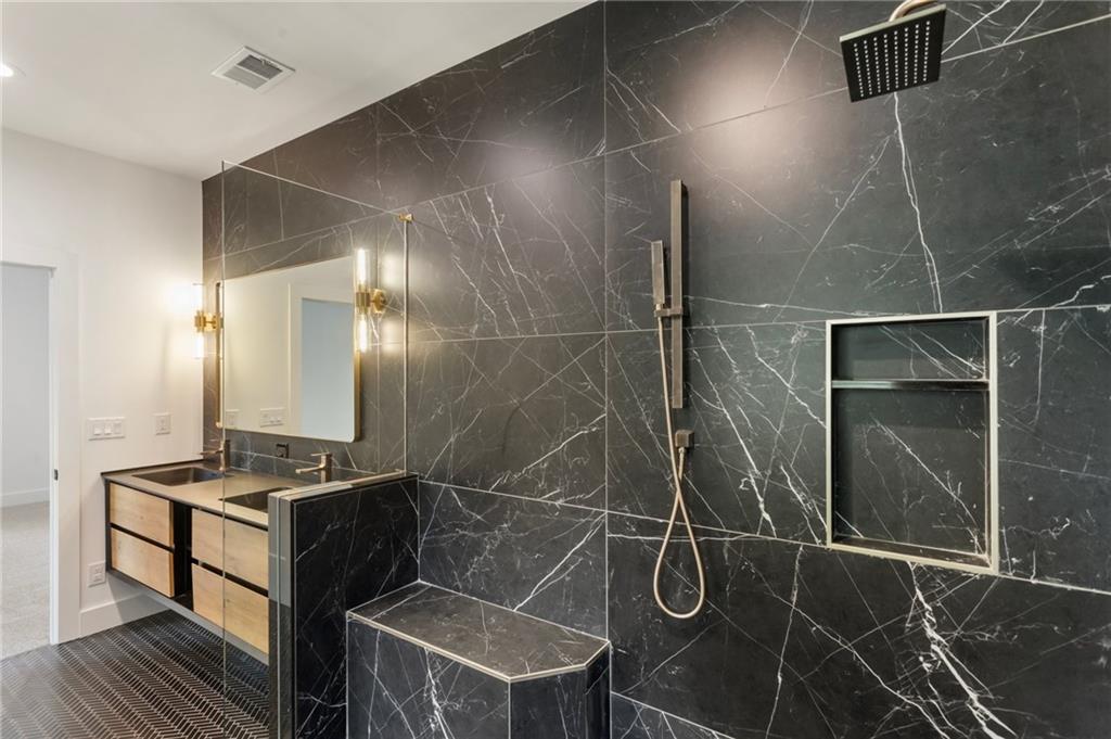 3711 Mountain Cove Road Snellville, GA 30039 - Photo 53 of 78 a bathroom with a shower and a sink