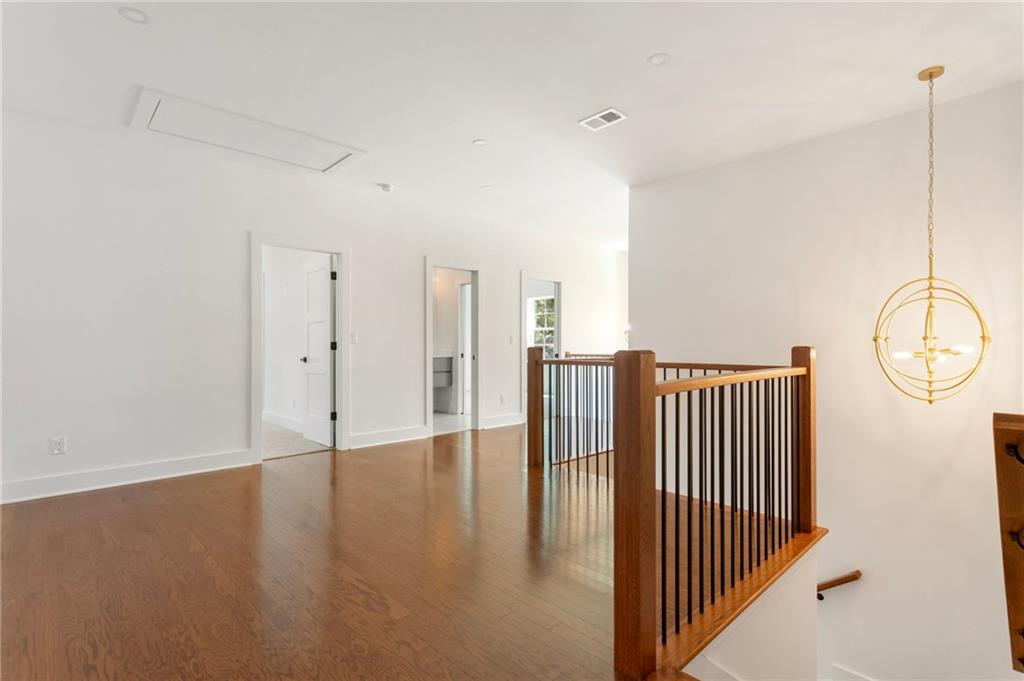 3711 Mountain Cove Road Snellville, GA 30039 - Photo 58 of 78 a view of a room with wooden floor and windows