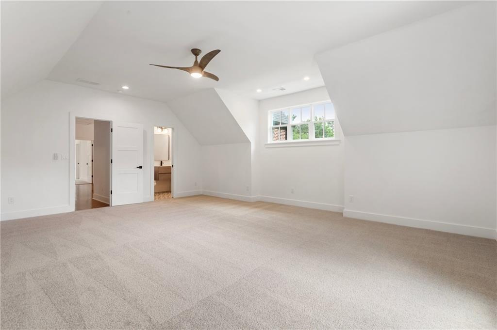 3711 Mountain Cove Road Snellville, GA 30039 - Photo 61 of 78 en empty room with windows and ceiling fan