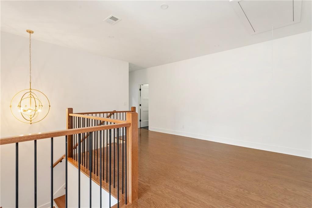 3711 Mountain Cove Road Snellville, GA 30039 - Photo 72 of 78 a view of a room with wooden floor and white walls