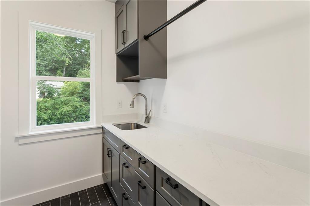 3711 Mountain Cove Road Snellville, GA 30039 - Photo 73 of 78 a kitchen with a sink and a window