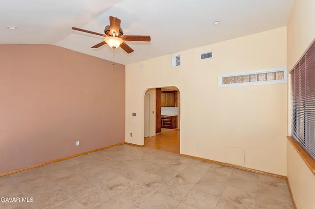 a bathroom with a double vanity sink mirror and toilet