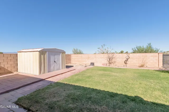 a view of a backyard door and a tub